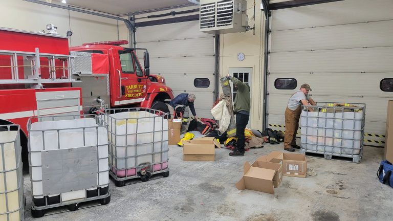 Tarbutt Fire Department members sorting and packing donations to Ukraine. •	69 sets of Bunker Gear with extra suspenders 
•	48 Helmets with extra hardware/parts 
•	18 Pairs of Boots 
•	50 (plus) pairs of Gloves 
•	7 SCOTT SCBA Harnesses & 2 Masks 
•	2 MSA SCBA Harnesses & 2 Masks 
•	1 Medical chair/stretcher 
•	Miscellaneous medical supplies (masks, bandages, etc.)